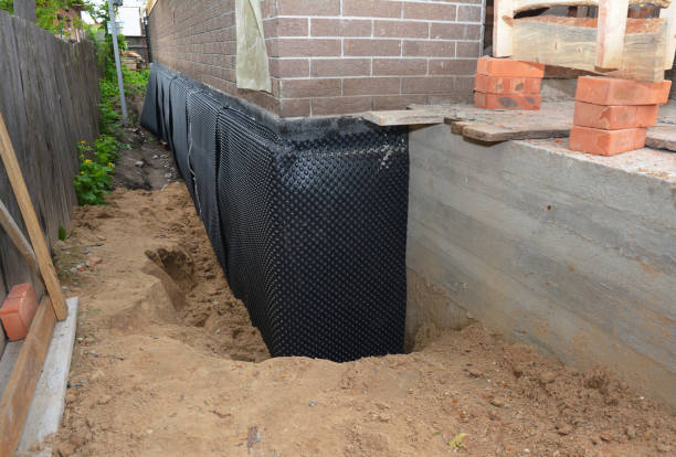 SJ Waterproofing Pros technician performing targeted Waterproofing assessment in Scipio Center, NY
